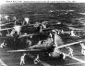 Aircraft, including Zero in foreground, prepare to
                launch in second wave against Pearl Harbor