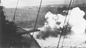 Photograph of
          battleship Maryland firing at targets on Okinawa