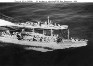 Aerial view of Cimmaron-class oiler refueling
                destroyer