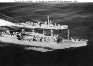 Aerial view of Cimmaron-class oiler refueling
                destroyer