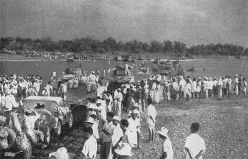 Civilians greet 1 Cavalry Division during its dash to
          Manila