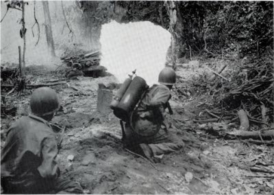 Flamethrowers attacking a Japanese bunker