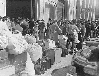 Photograph of
      Japanese-Americans awaiting internment