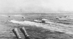 Photograph of landing craft coming ashore on Iwo Jima