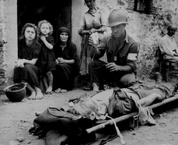 Photograph of medic administering plasma