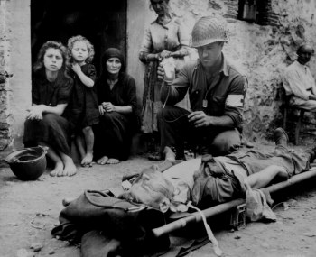 Photograph of medic administering plasma