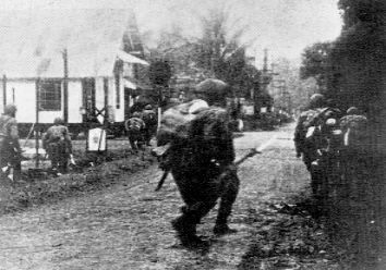 Photograph of Japanese troops assaulting Menado