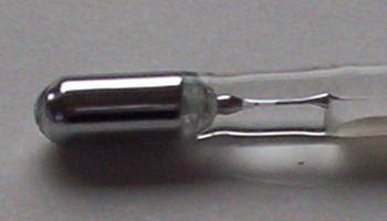 Photograph of thermometer bulb containing mercury metal
