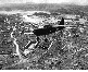 Observation aircraft over ruins of Naha