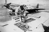 Photograph of P-51 guns being loaded