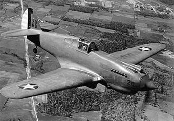 Photograph of P-40 Warhawk in flight
