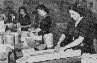 Photograph of women preparing leaflet
        bombs