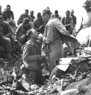 Marines receive Communion atop Mt.
        Suribachi