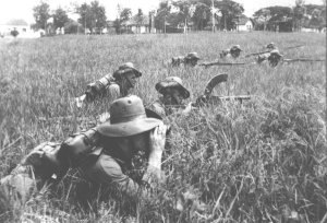 Photograph of KNIL infantry on drill