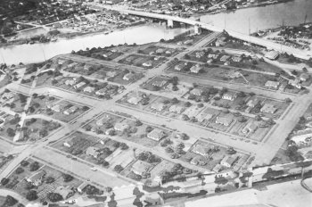 Photograph of Seattle
                factory camoflauged as suburb