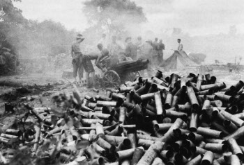 Photograph of a pile of expended shell casings at the seige of Mytikyina