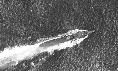 Photograph of IJN Chikuma, a Tone-class cruiser, under aerial attack