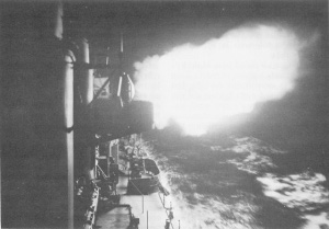 Photograph of U.S. warship firing on Japanese destroyers, 18 August 1943