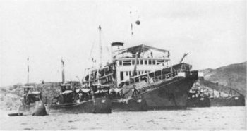 Photograph of tender Zuiderkruis with submarines alongside